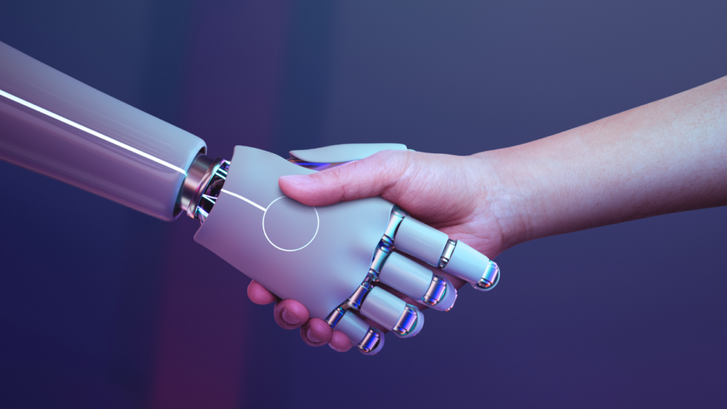 Aperto de mão entre humano e máquina